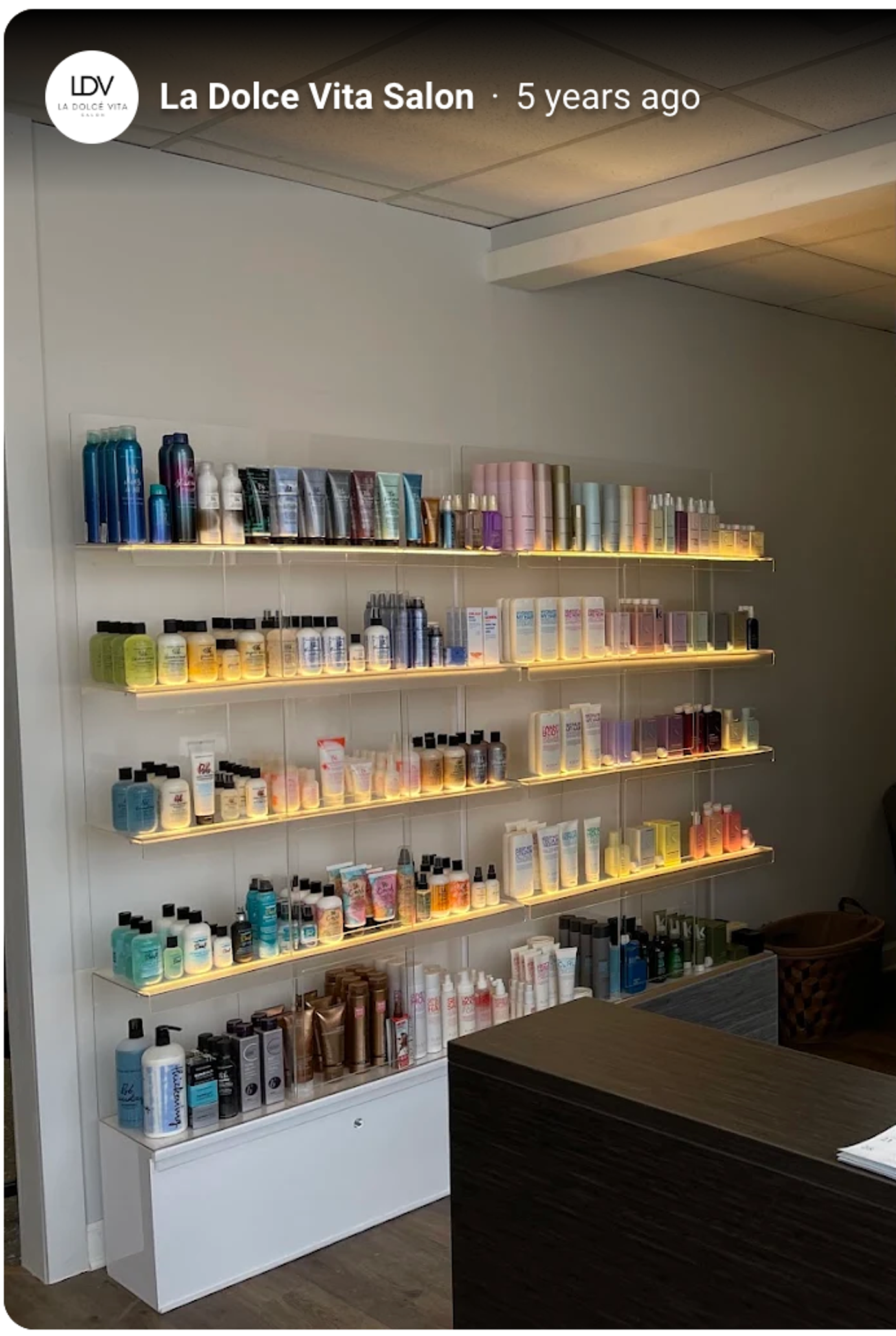 Backlit retail wall of premium haircare products