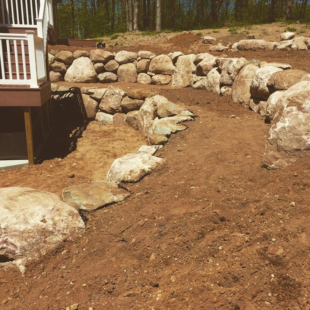 Finished boulder retaining wall, 1 to 5 foot boulders, Boyne City Michigan