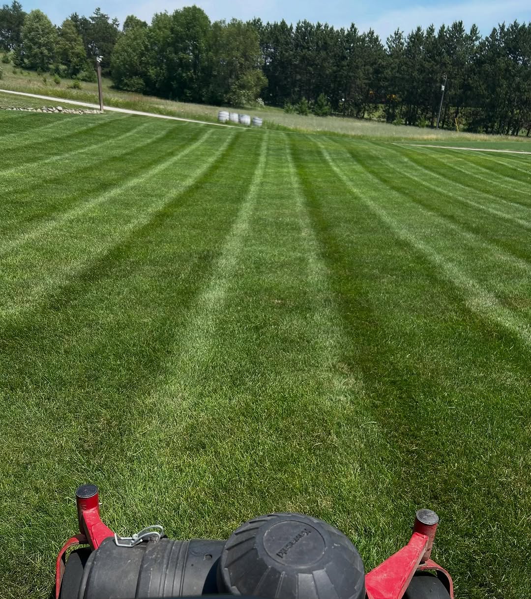 Mow crew at work with visible stripe lines, Boyne City Michigan