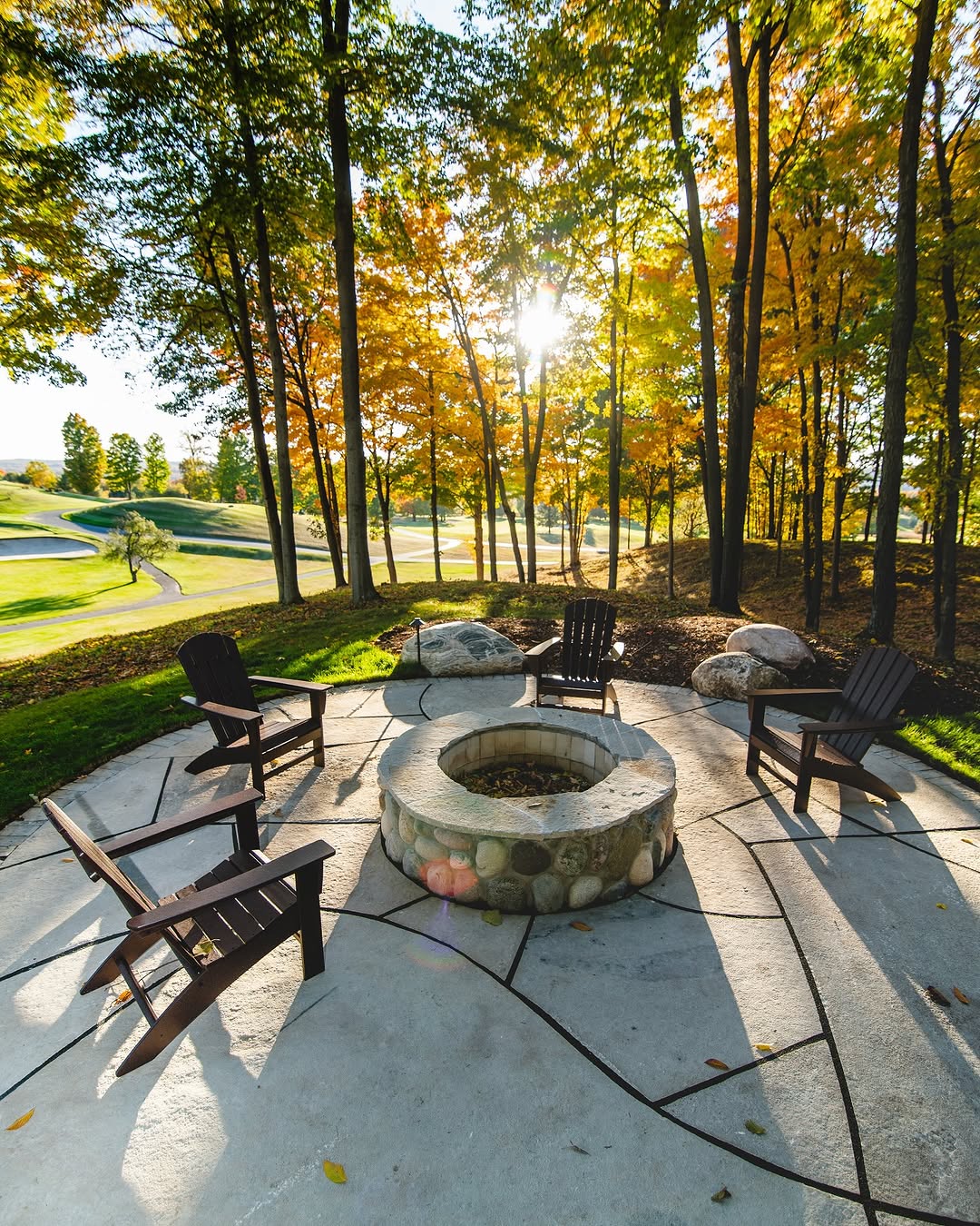 Paver patio with outdoor fireplace installed in Boyne City, Michigan